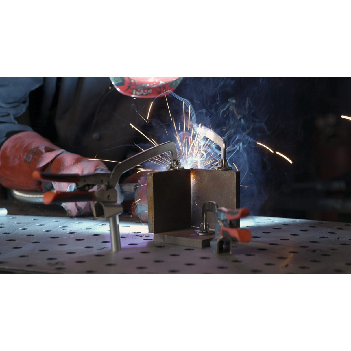 Armor Tool Auto-PRO Hold Down Clamp 76mm in action securing workpiece on welding table