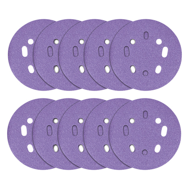Multiple purple sanding discs with holes on a white background