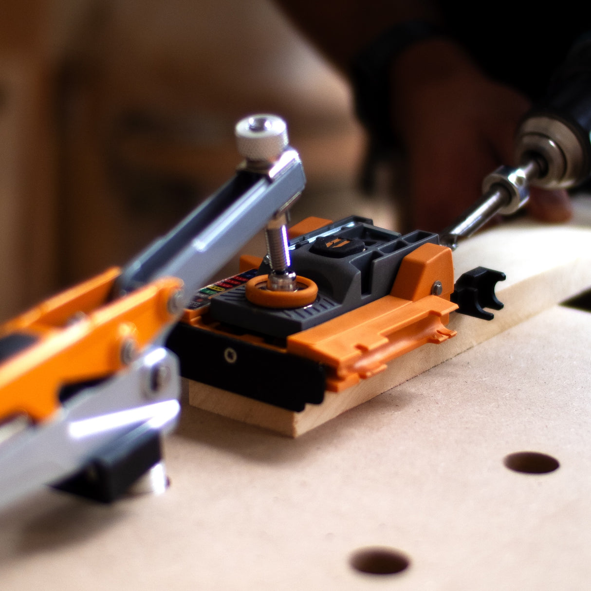 Compact self-adjusting pocket hole jig for wood joinery solution, angled view, BORA Tool Automatic Mini Pocket Hole Jig