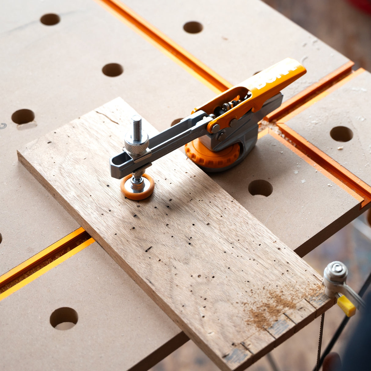 BORA Tool Auto Adjust 75mm Reach T-Track Standard Toggle Clamp in use on woodworking project