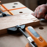 Australian-made BORA Tool Dog Hole Auto Adjust Inline Toggle Clamp in use on workbench
