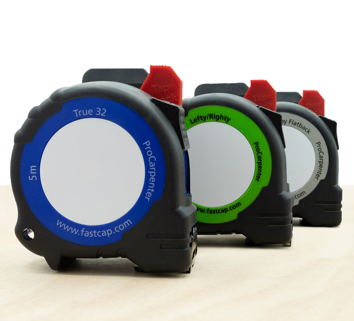 Three ProCarperter tape measures with color-coded ends on a white background