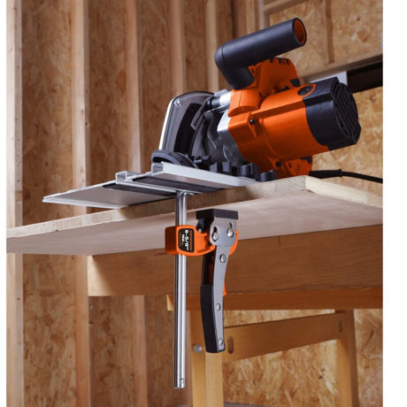 Circular saw mounted on a workbench with wooden background