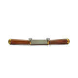 Wooden and brass spokeshave on a white background