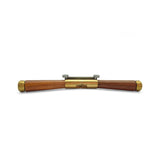 Wooden and brass spokeshave on a white background