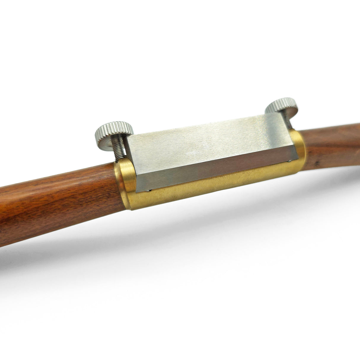 Wooden and brass spokeshave blade on a white background