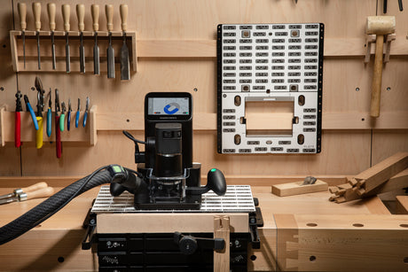 Shaper Tools Origin Handheld CNC Router in use on wood slab