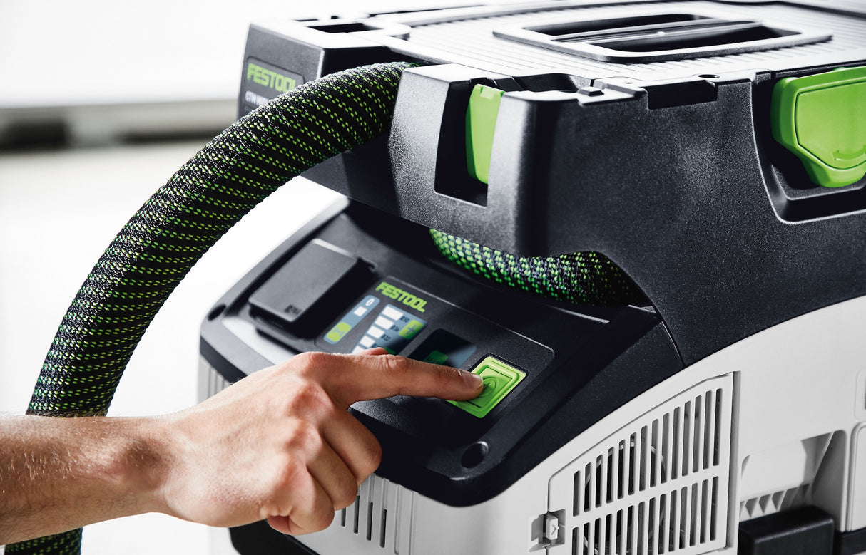Compact Festool CTM MIDI-I 15L M Class Dust Extractor in action, featuring intuitive touch operation and smooth suction hose